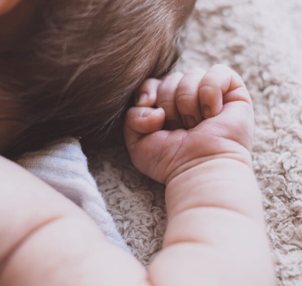 Baby plays on rug