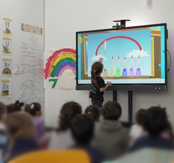 Child at Platinum Preschool using BenQ board